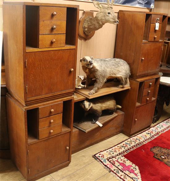 A 1930s oak dwarf cabinet and a pair of matching bedside cabinets Dwarf cabinet 175cm, pair 45cm